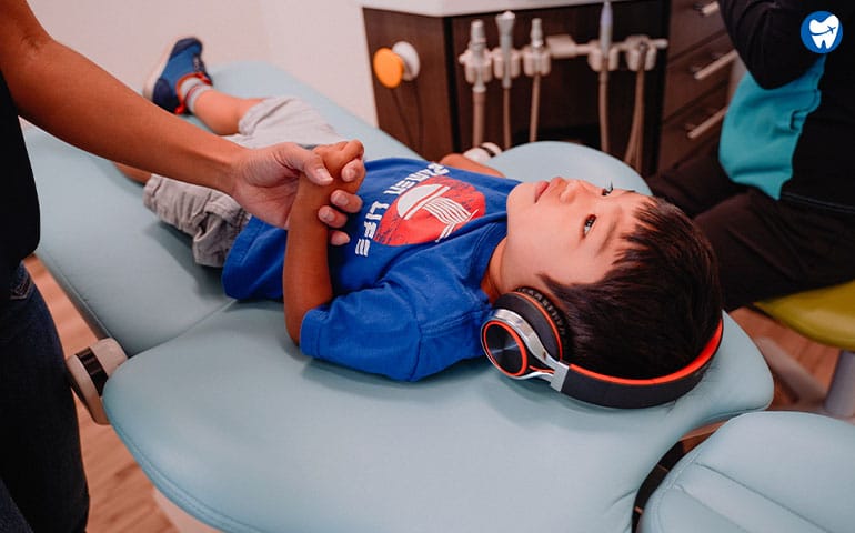 Children dental checkup with audio visual aids