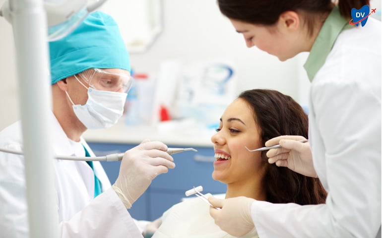 Dentist examining a young patient