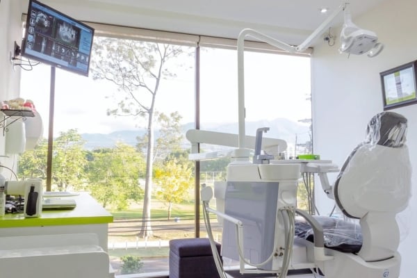 dental clinic in costa rica with grey dental chair overlooking greenery